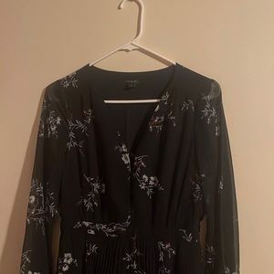 It is a black dress with flower prints